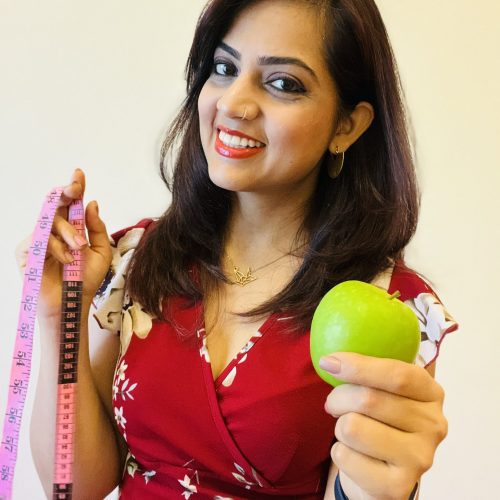 Me-holding-apple-meas-tape-scaled.jpg